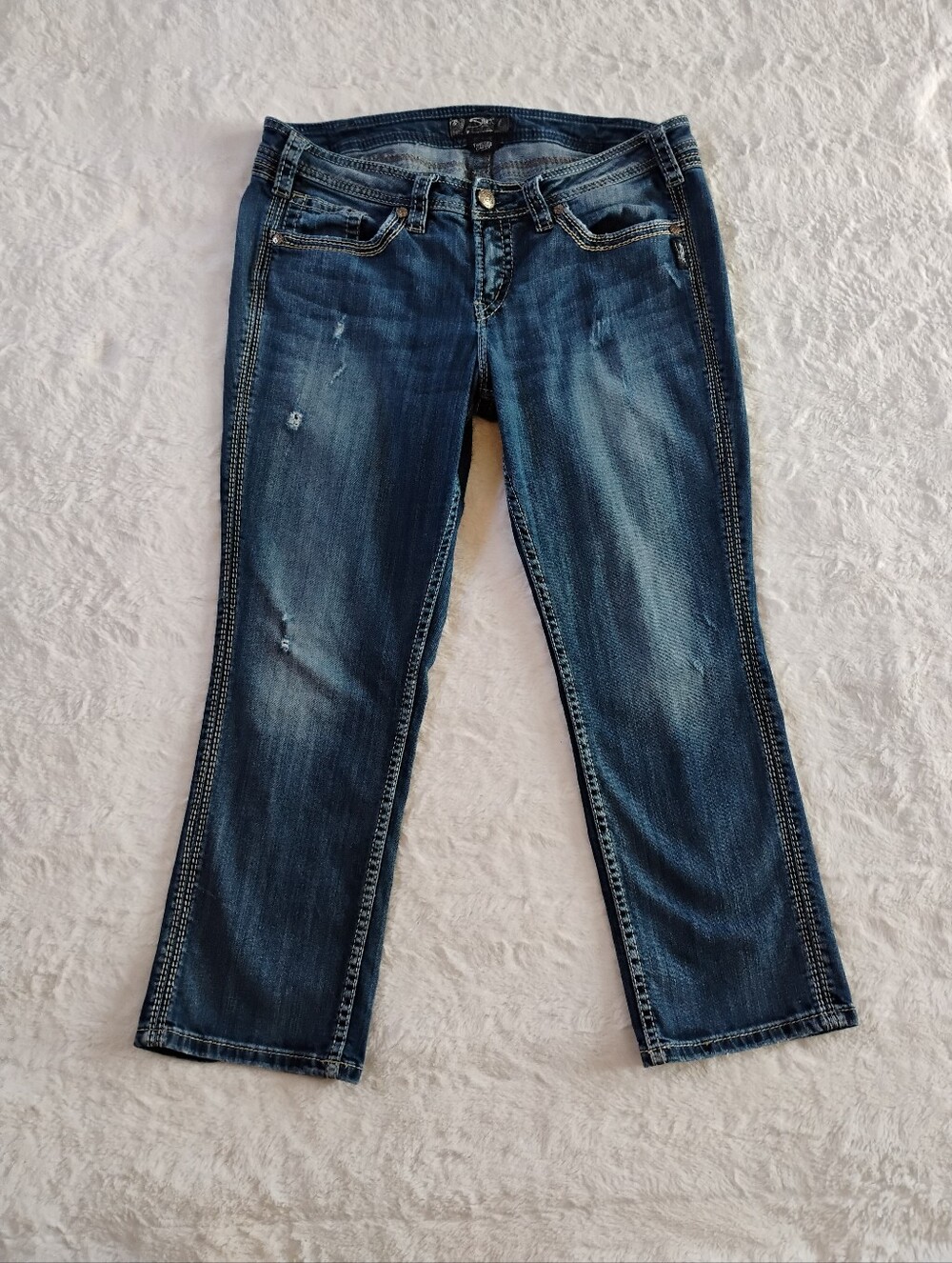 Silver Jeans Distressed Twisted Capri Jeans